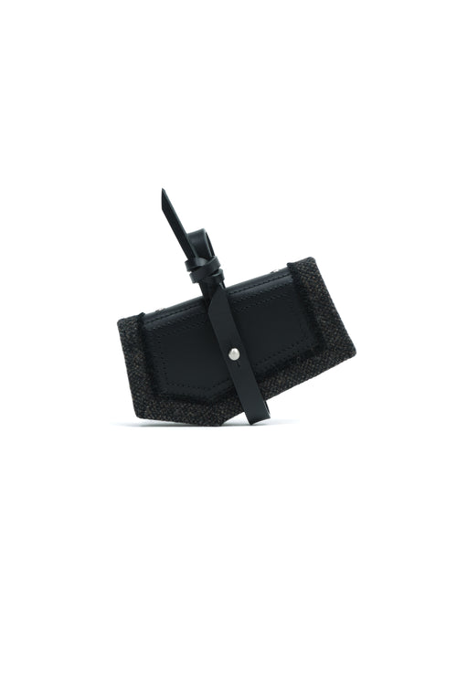 Epijé Gardener's Note in Black with a textured black fabric backing and a small silver snap button, shown on a plain white background.