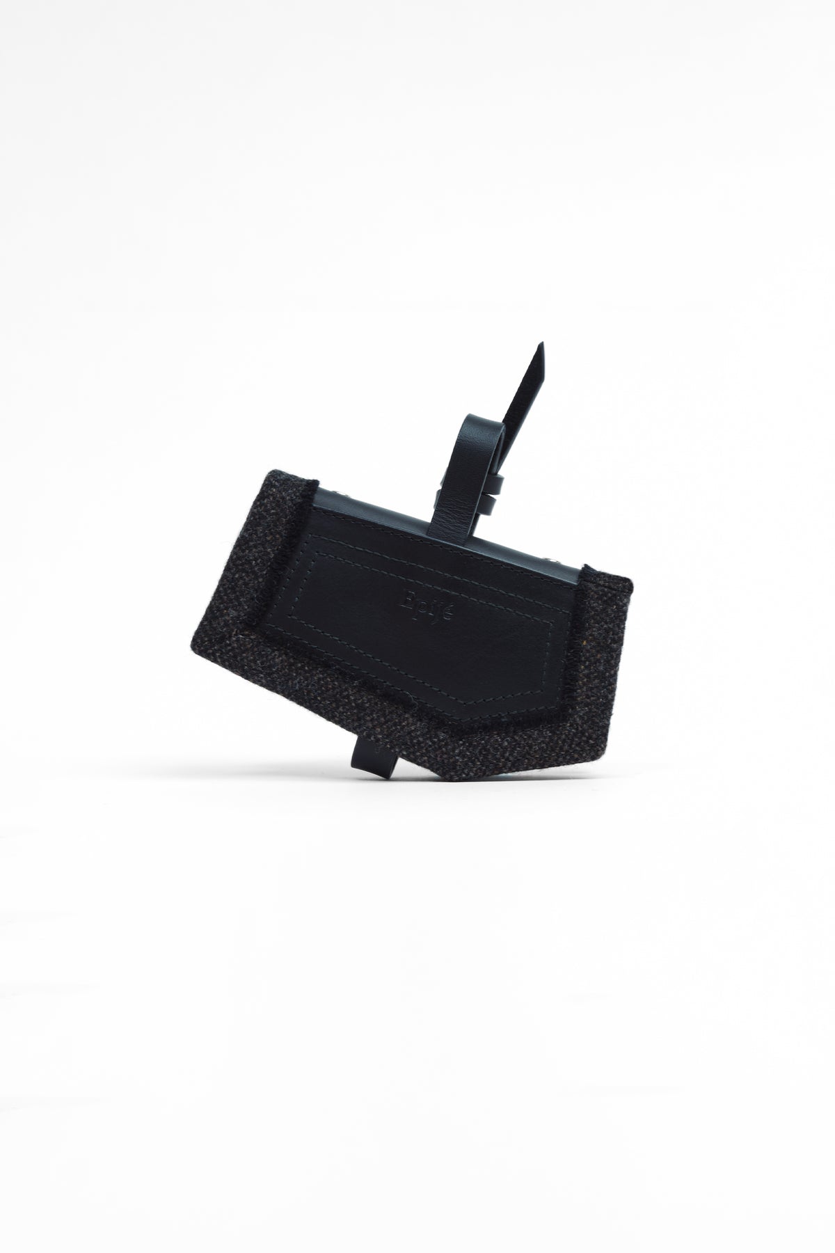Epijé Gardener's Note in Black with a textured woven border and a small black tag attached to the top loop, photographed on a clean white background.