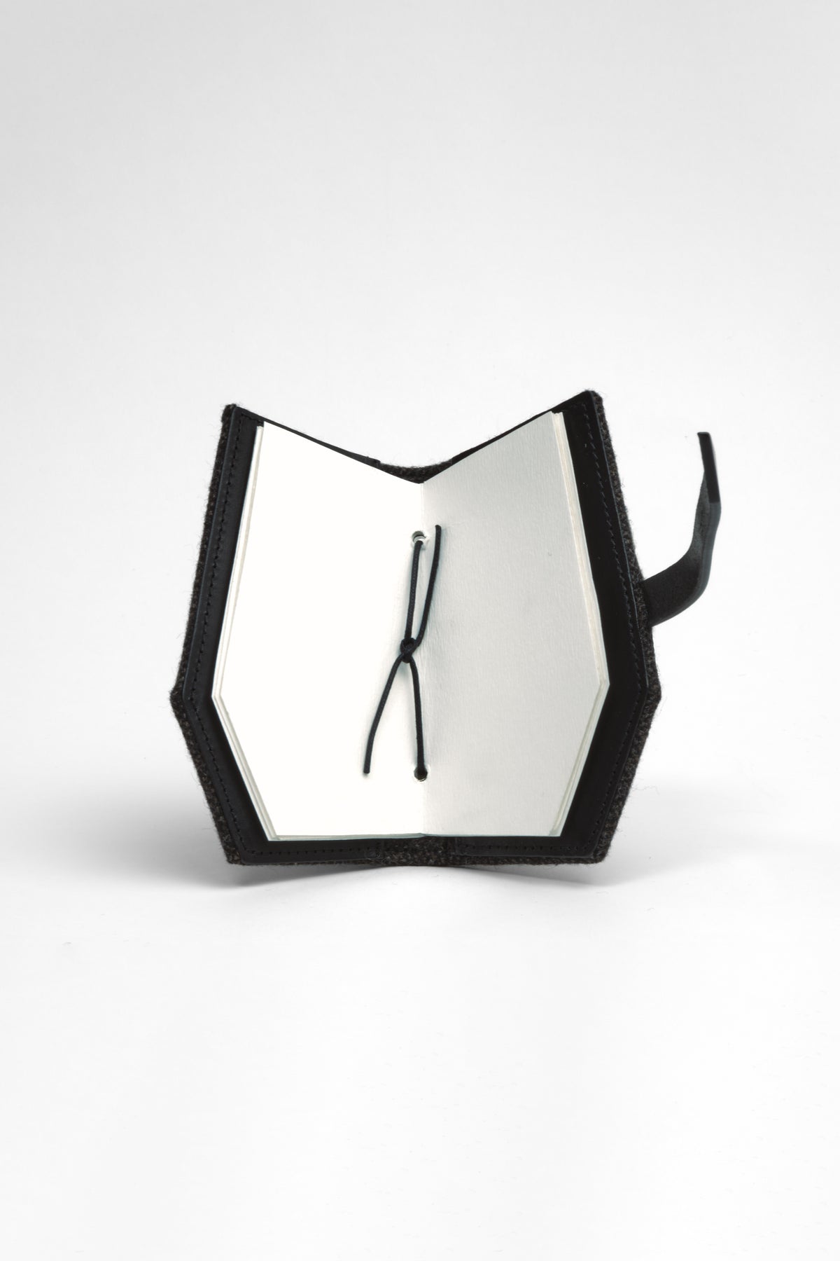 Epijé Gardener's Note in Black with a strap, shown open on a light gray background.